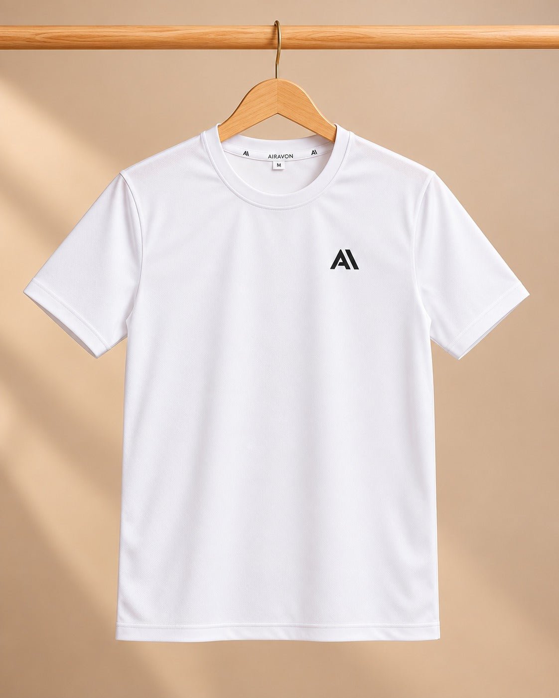 Airavon White sports T-shirt on a wooden hanger