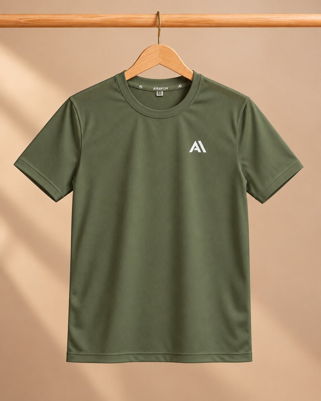 Airavon Olive green sports T-shirt on a wooden hanger, full view