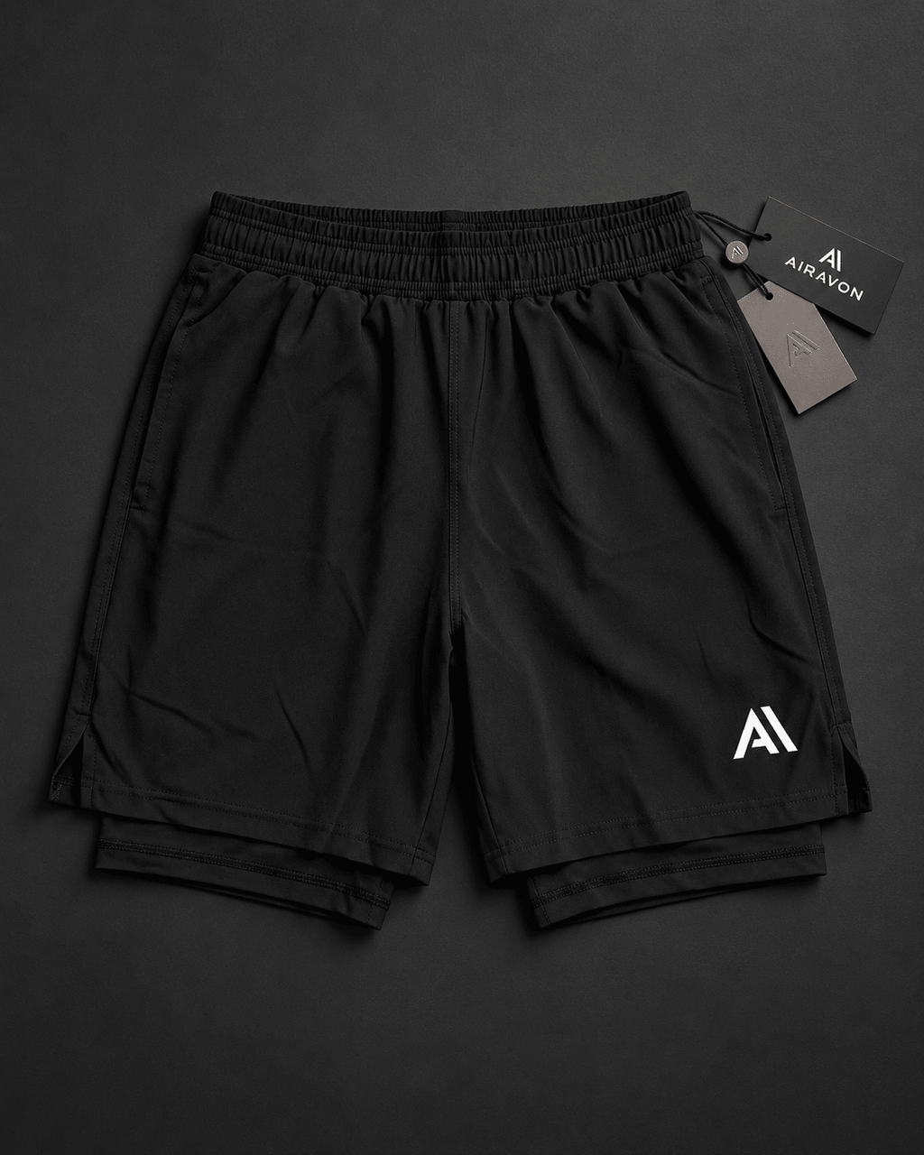 Airavon Black performance shorts laid flat with tags