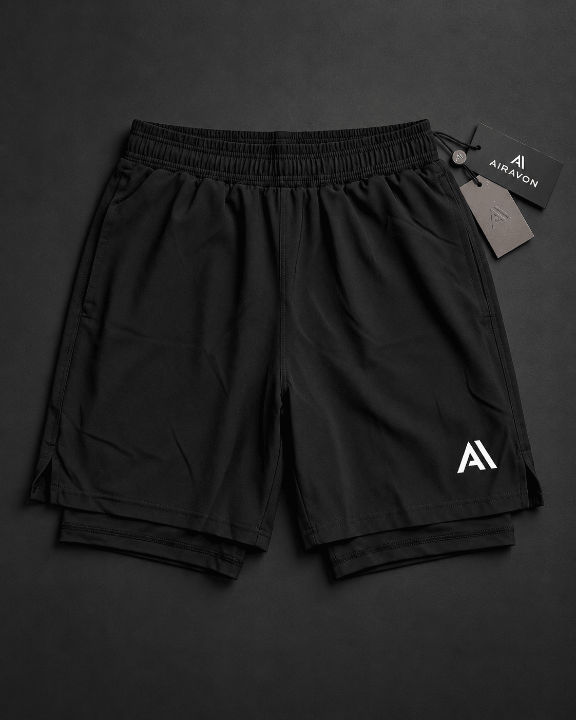 Airavon Black performance shorts laid flat with tags
