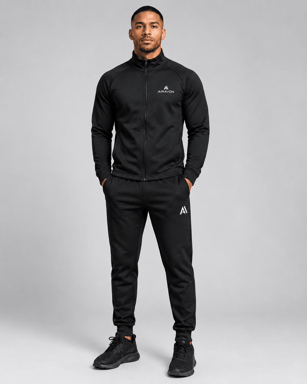 Airavon Model wearing a black tracksuit, studio view