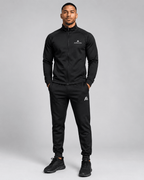 Airavon Model wearing a black tracksuit, studio view