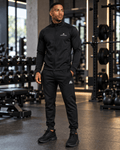 Airavon Model wearing a black tracksuit in a gym