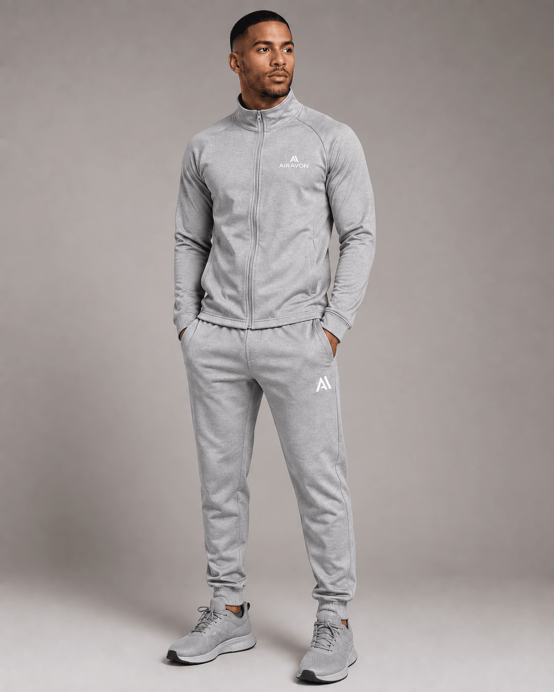 Airavon Model wearing a light grey tracksuit, studio view