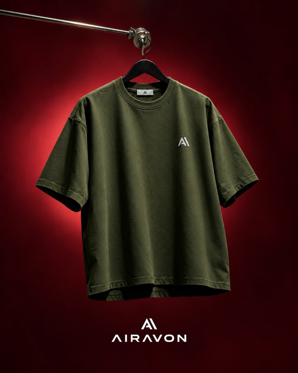 Airavon Olive green oversized T-shirt hanging against a red background
